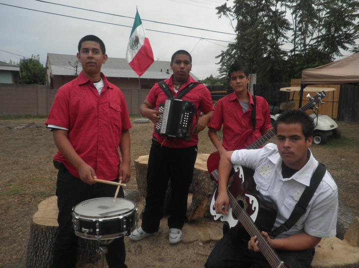 Grupo  Comandante practices on October 17 at Mario and Marco Arroyo’s house for their next performence which would be on October 23. The boys practiced while family member watched and enjoyed the music coming from their backyard.