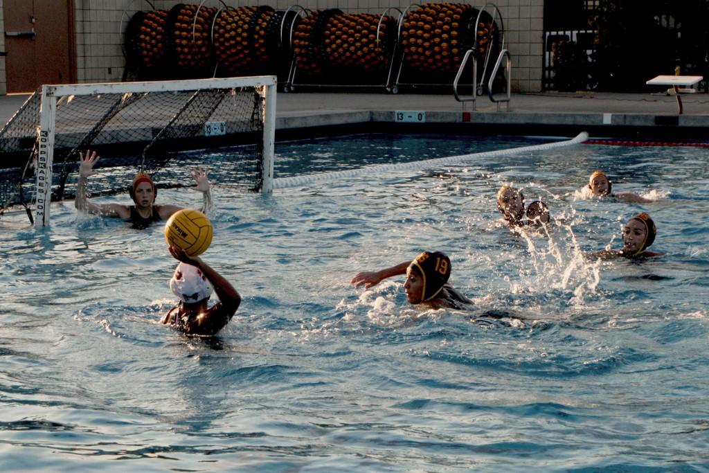 Preparing to block her rival against Bell Gardens, Janel Madrigal stops the competition from scoring at the Downey City Pool on Jan. 17.  Vikings conquered Bell Gardens with a final score of 11-7.