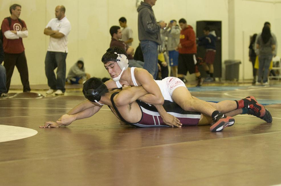 Wrestling for the League Finals, Jacob Barberena, 12, uses the technique “chicken wing” on his opponent at Paramount High on Feb 11. The Vikes went on to win CIF for the second time.