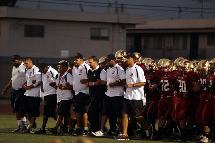 As the last pre-season game starts, on Friday, September 21, the varsity football team shows unity as they enter the Allen Lane Stadium with locked arms. The team’s recent 3 to 2 wins, have them optimistic for a victory in the up coming match against Warren.