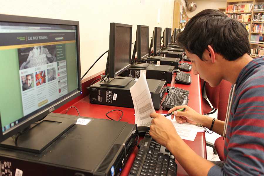 As the window of opportunities for college applications rapidly shrinks, Omar Almanza, 12, applies online, in advance, in the library, to receive approval from his two favorite colleges: Cal State Long Beach and Cal State Poly Pomona. Almanza has attempted to complete his first college essay by writing about his faith in music.