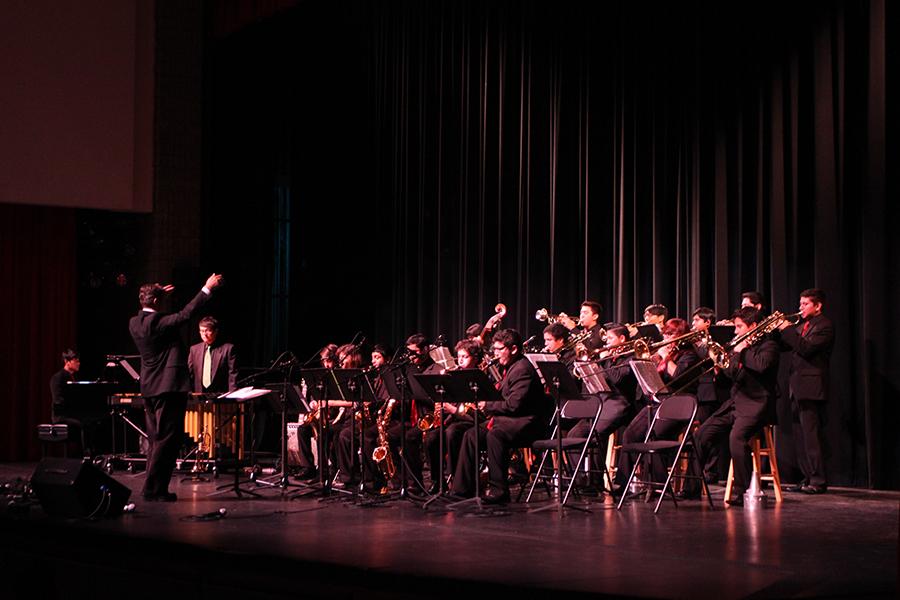 Under the direction of Mr. Olariu the Jazz Band performs at the Downey Civic Theater on, Dec. 12, for the Winter Concert put on by the music department. The Jazz Band drew cheers from family and friends with various Christmas songs and renditions.