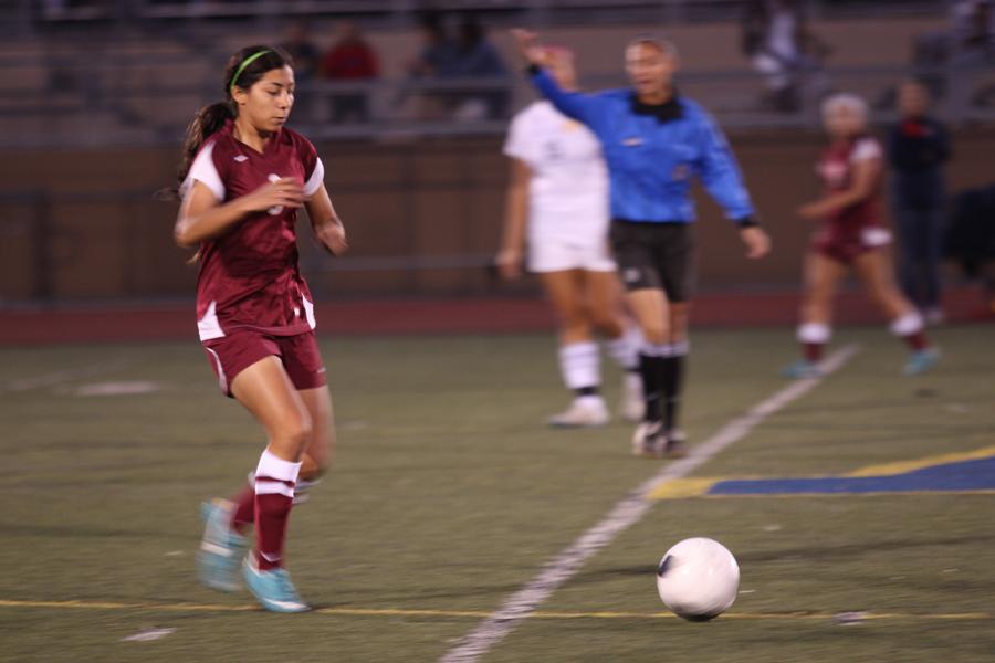 At the Downey vs. Warren game on Jan.8, Maritza Acuna,11, goes for the ball before her opponent. Downey scored 1-0 in the second half of the game. 