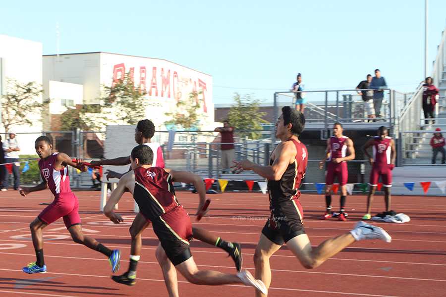 One of three hand offs is made by Ismael Guerrero,12, to Anthony Bravo,11, for the second leg of the boys 4x4 relay race on Mar. 27, at Paramount High School. This is one of the biggest league meets of the year,” Bravo said, “and it all comes down to the four by four.