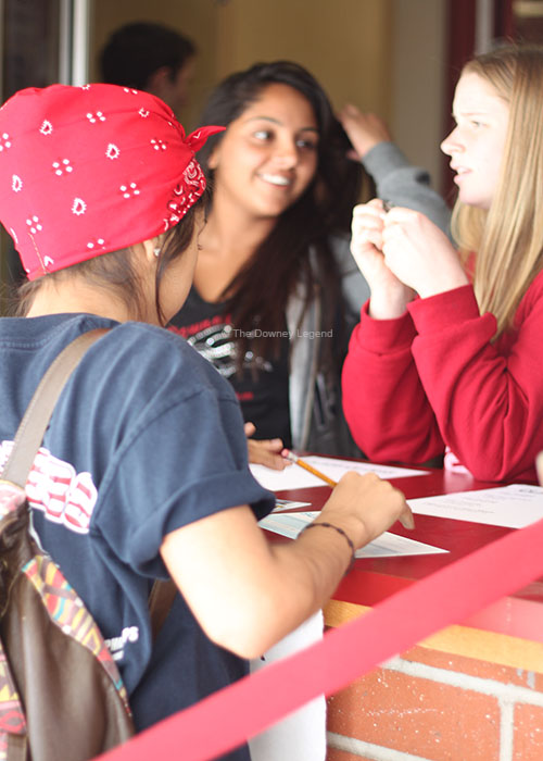 Stopping by the ASB window, Selena Corral, 11, casts her vote for the 2013-2014 ASB Student Council during A lunch. “I helped a friend of mine out by spreading the word on Twitter and Instagram because I feel he would be a great candidate for ASB,” Corral said