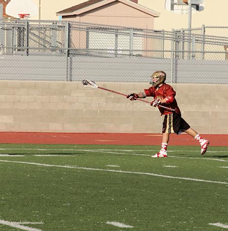 On March 4, Captain Nick Farina, 12, assists in making a goal with his two siblings at the game against opponents Palos Verdes. “It feels different playing with them, but we can read each other so its an advantage,” Farina said.