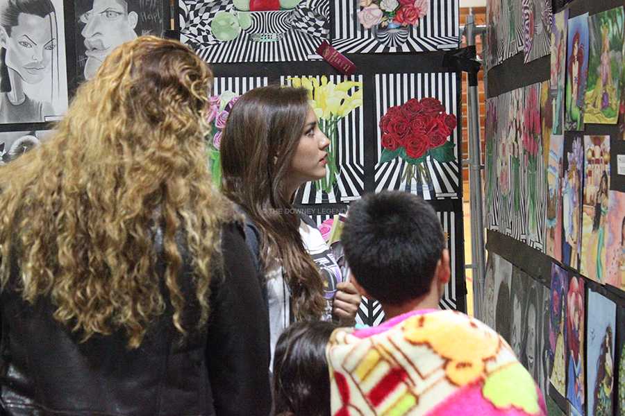 During Open House, students and parents arrive to the gym for the art show to see all the work done by students. The art show is one of my favorite parts about Open House, parent, Stephanie Hernandez said, because the art is very well done and creative. 