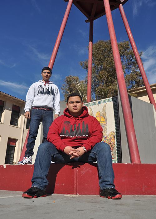 On Tues., Dec. 10, juniors Ricky Venegas and Alex Rivera, owners of LA living, show off original sweaters designs. Venegas and Rivera sold their merchandise to people around the Downey community. 	
