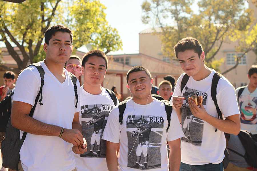 On Jan. 17 Jorge Reyna, 11, Nicholas Robles, 12, Eric Carillo, 12, and Troy Stricklin, 12, wear white to show their school spirit for the annual Black Light assembly.