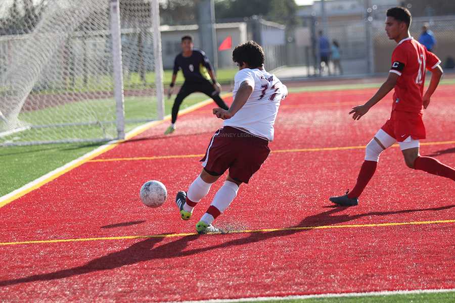 On Wed., Feb. 12, Roberto Astorga, 12, heads for the goal during the game against Dominguez High School. Downey took the win with a final score of 4 to 0.