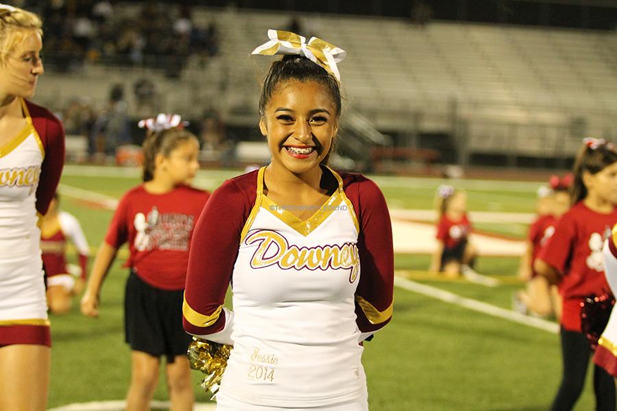 On Fri., Sept. 20 at the Allen Layne stadium, varsity cheerleader Jessie Herrera,10, performs a routine during the halftime. “It’s crazy, at practices, in class, on my way home, I see all the routines in my head,” Herrera said.