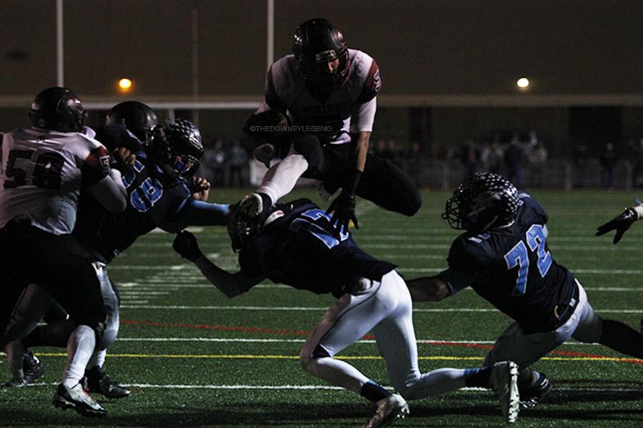 On Dec. 5 at Glendale high school, senior Justin Huff (5) hurdles over one of Crescenta Valley’s players for a touchdown. “Seeing that play right in front of my eyes was so unreal, it was one of the memorable plays of the game,” said Stephany Gonzalez.