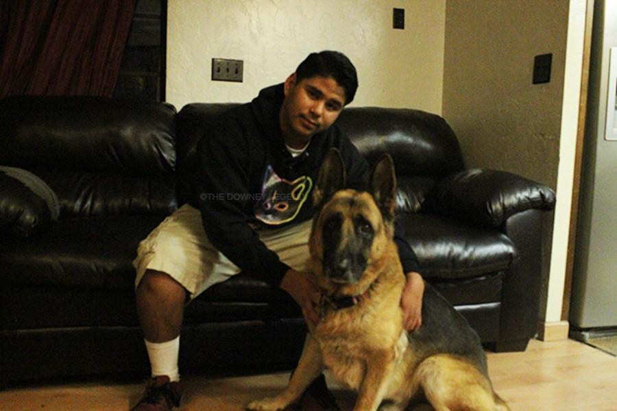 On Jan.12, junior Nathan Anaya hugs his long time best friend, Dodger. “Dodger looks mean, but he is nice and is really good with people,” Anaya stated.