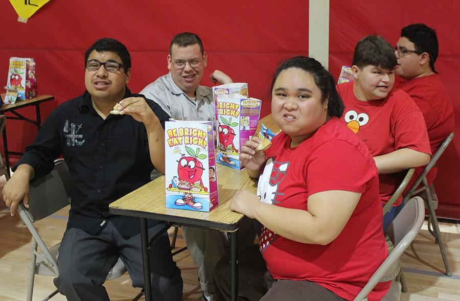 On Feb. 12, the Amigos enjoy their Be Bright, Eat Right goody bags, in the gym, during the Valentine’s Day dance. The Downey High School Amigos Club conducts several special events throughout the year to associate students, with special needs, with the club members. 