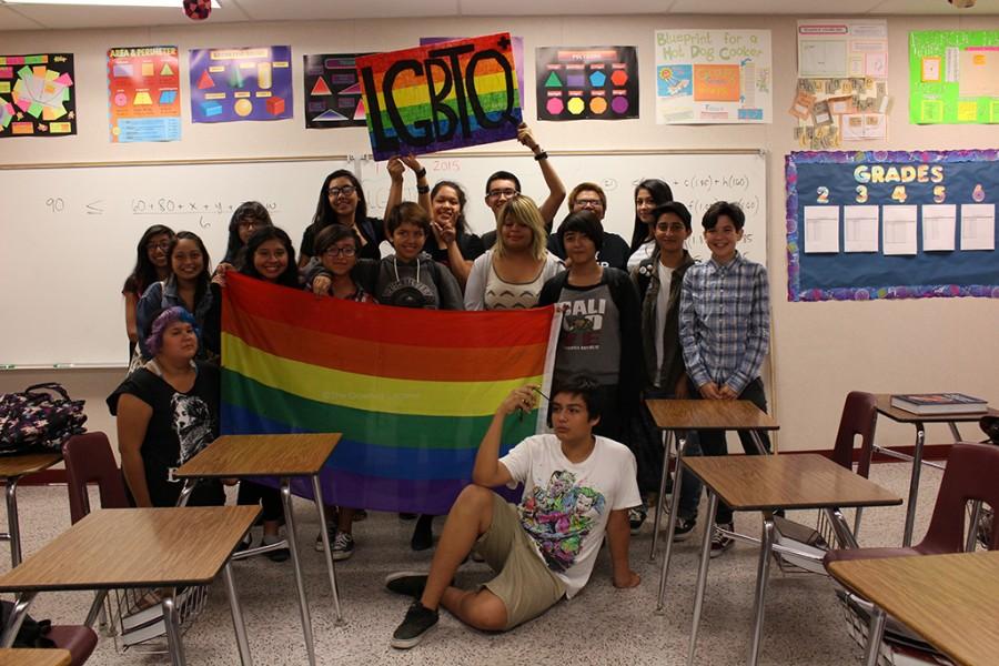 After their second official meeting of the year, members of the LGBTQ+ club pose for a picture in C105. They listened to each other’s stories of how they came out to their friends and parents.