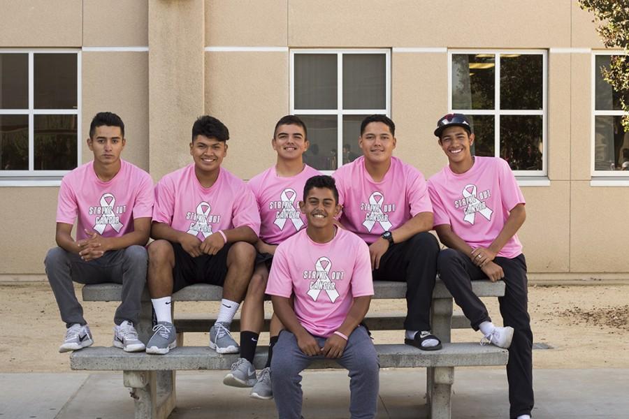 To show support, for Breast Cancer Awareness Month, this October, Kyle Vasquez, 11, and his baseball teammates sport their “Team Emma” shirts for Vasquez’s mother who is currently battling breast cancer. “We’re a team,” Arnulfo Serrano, 11, said. “It’s family.”