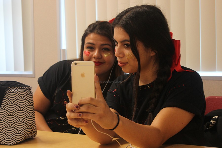 Wearing gold and red glitter, seniors, Christiana Nicole Lagunas and Kristianna Deanna Gastelum, take a selfie on October 23 during passing period. “I’ve got spirit, how ‘bout you, I’ve got spirit whoop dee doo,” Gastelum stated.