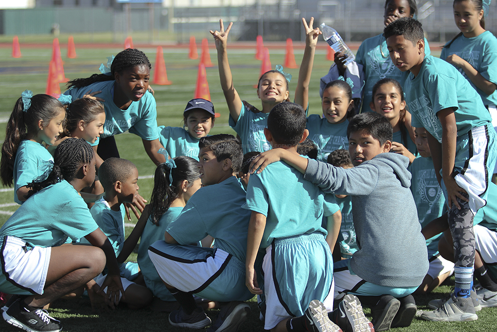 Encouraging one another before the big race, participants from Maude Price Elementary School huddle for the final portion of the competition, which will determine the win, on April 30 at the Warren High School track. Maude Price then proceeded to place 6th overall.