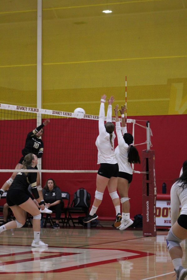 Jumping up for a block attempt, Hailey Harris, 12 and Carissa Mendibles, 12 asserts their thoughts on how the school spirit encourages the team to keep playing at their best. “[Viking Nation] Definitely helps a lot; like I said we were a little bit quieter than usual,” Harris said. “But having all of our fans here and our cheerleaders really pumped us up.”