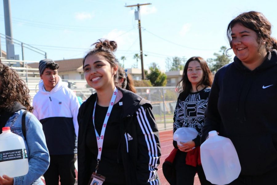 Participating in Kiwin’s Walk for Water event on Feb. 9, Katherine Trujillo, 12, carried jugs of water in the DHS track for the purpose of experiencing what some people in Africa go through everyday to get water. “I think this event brought a more physical aspect of what women and children go through as their everyday duty,” Trujillo said. “It might not be exactly what they go through, but it sure does give people a glimpse.”