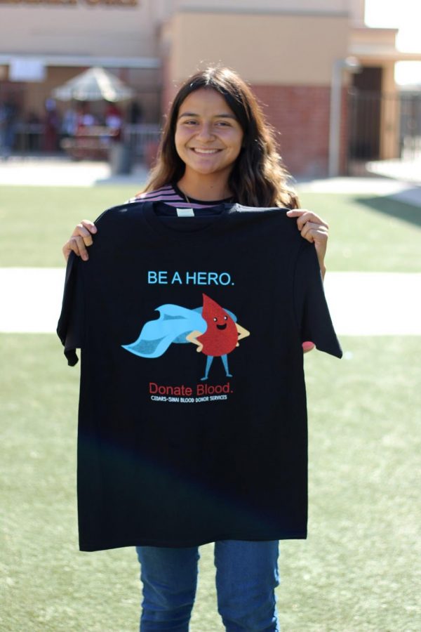 After donating a pint of blood, Kristen Salguero, 12, happily left with a free t-shirt she got for donating. “I chose to donate blood because I really enjoy helping those in need,” Salguero said. “This is my third time donating blood so it’s become a very easy process for me and I plan to continue donating.”