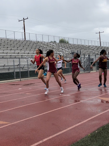 While doing a handoff in the girls varsity 4x200, senior Mikala Fletcher was second leg in the event receiving the baton from junior, Bryanna Anderson. “The 4x200 is a really fun event because it only happens on relay meets so it’s fun to do it when I get the chance,” Fletcher said. “This is my last high school track season and I’m pretty eager to finish strong.”
