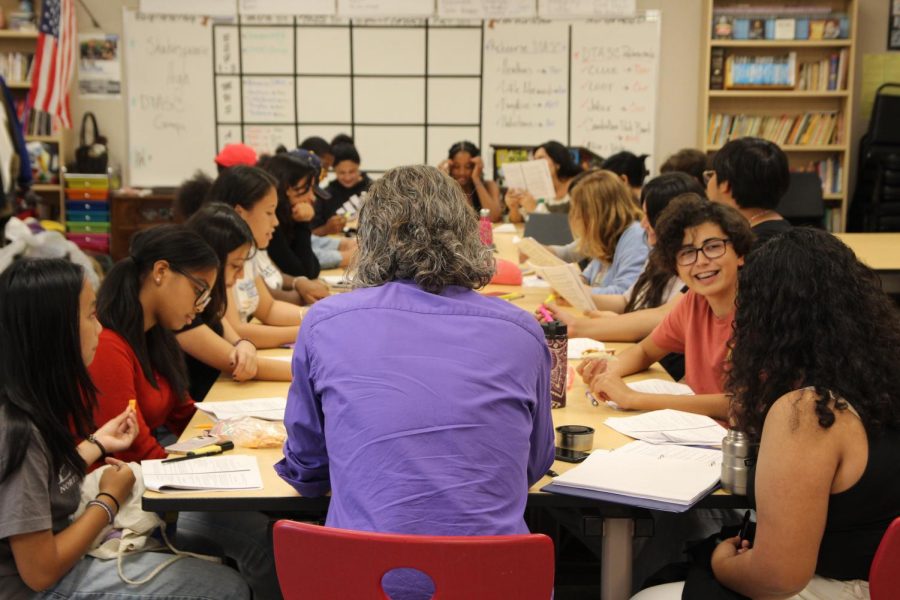 Acting as a substitute for an absent student, Mr. Nelson, director, reads a scene from Puffs with the cast in the second readthrough of the play. “I am very very lucky to have this job,” Nelson said. “It’s rewarding to get to see the effects of what I do and what I do is share the thing that I love.”